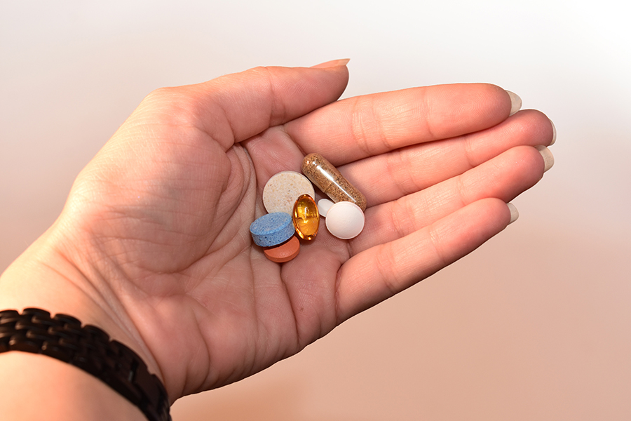 Hand Holding Medication to Pack for Everest Base Camp Trek