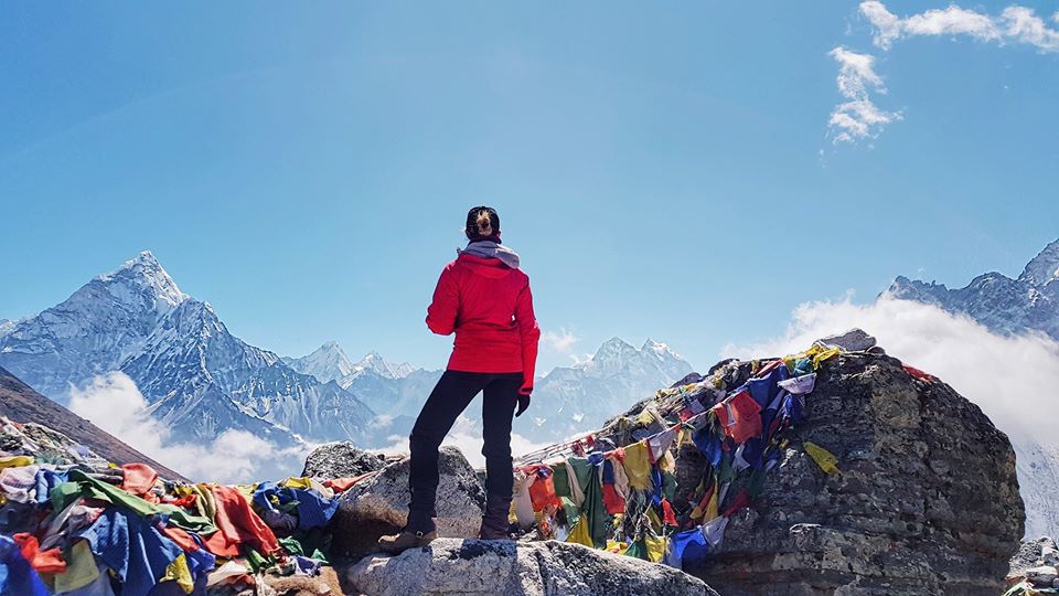 Everest Base Camp Hiker Wearing Waterproof Jacket at Base Camp for Packing LIst