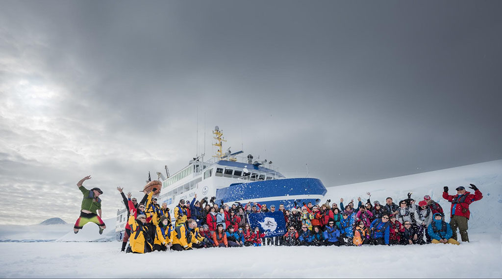 Group Photo of Guests in Front of the Ocean Nova – Photo: Antarctica21