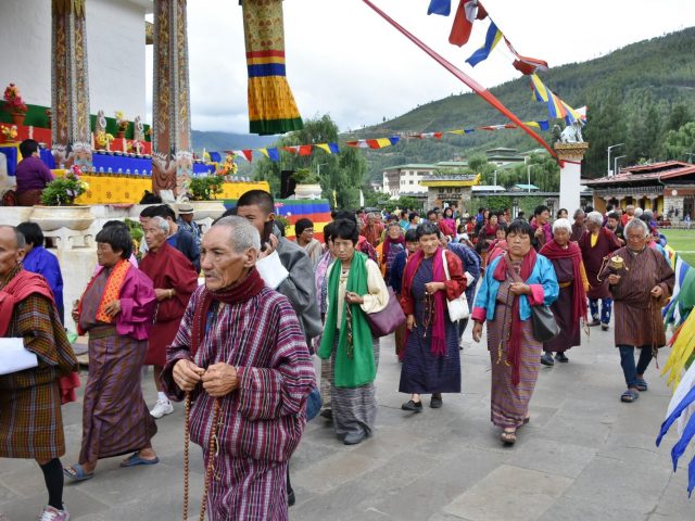 Bhutanese People In Traditional Garb Outside National Memorial Chorten